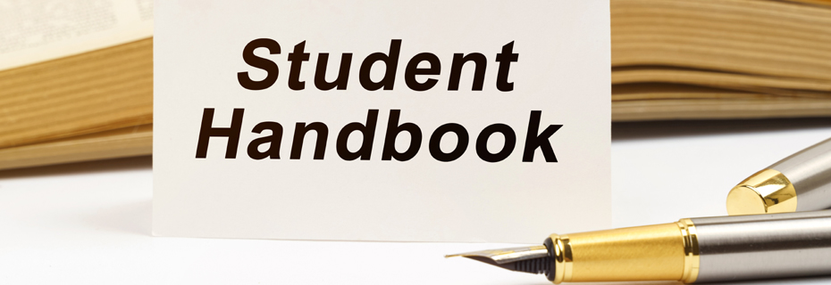 Education concept. Against the background of the book lies a pen and a business card with the inscription - Student Handbook